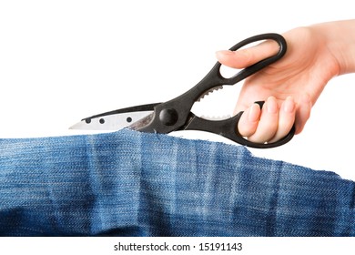 Woman hand cutting piece of fabric. Isolated on white.