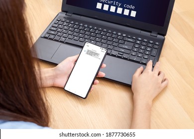 Woman hand enter a one time password for the validation process, Mobile OTP secure Verification Method, 2-Step authentication web page. 