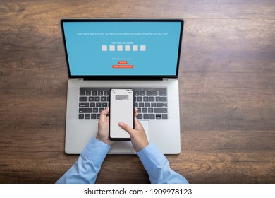 Woman  hand enter a one time password for the validation process, Mobile OTP secure Verification Method, 2-Step authentication web page. - Shutterstock ID 1909978123
