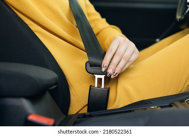 Woman Hand Fastening Car Safety Seat Belt. Protection Road Safety Snap Driving. Driver Fastening Seatbelt In Car. Woman Car Lap Buckling Seat Belt Inside In Vehicle Before Driving.