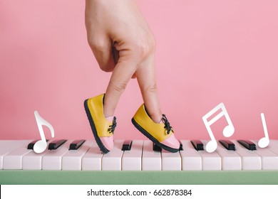 Woman Hand Finger Walking On Piano Between Music Note With Shoe Concept, Music Lesson School Education Concept, Dance Exercise For Good Healthy. 