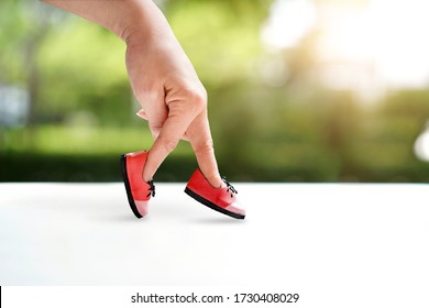woman hand finger walking with shoe concept, Traveler adventure outdoor summer vacations concept, Healthy lifestyle concept. Stay at home quarantine for coronavirus.