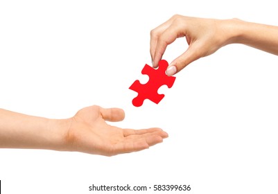 Woman Hand Give Red Puzzle To Man Isolated On White Background