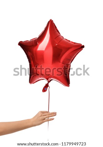Woman hand give single big red star latex balloon for birthday party isolated on a white background