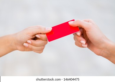 Woman Hand Giving Credit Card To Pay With It.