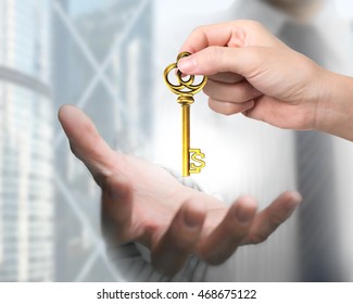 Woman hand giving golden treasure key in dollar sign shape to man hand. - Shutterstock ID 468675122