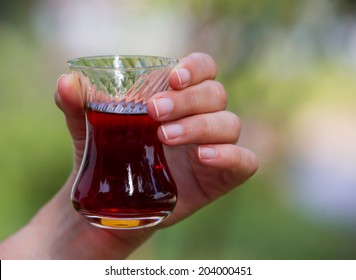 Woman Hand With A Glass Of Turkish Tea