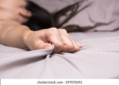 Woman Hand Grasp Bed Sheet