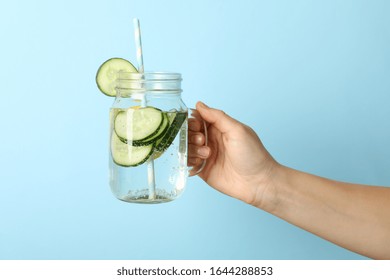 Woman Hand Hold Glass Jar With Cucumber Water, Space For Text