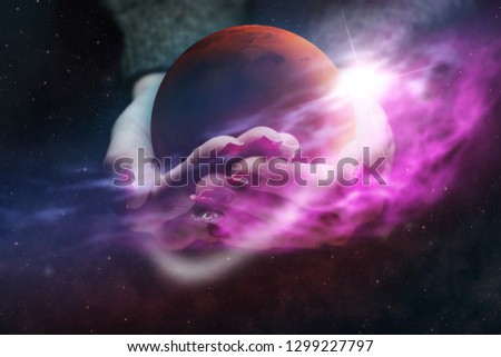 Woman hand hold New Home Mars. Nebula dust. Mixed media.