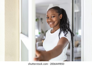 Woman hand hold retractable pleated insect screen holder to open or close the balcony door,mosquito nets - Powered by Shutterstock