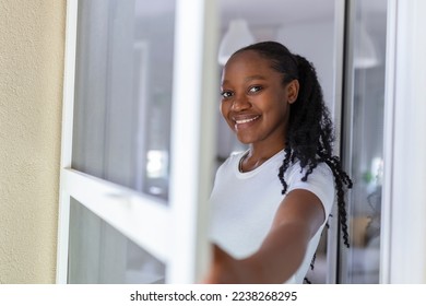 Woman hand hold retractable pleated insect screen holder to open or close the balcony door,mosquito nets - Powered by Shutterstock