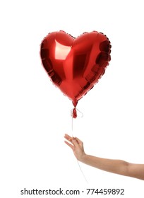 Woman hand hold single big  red heart balloon object for birthday party or valentine's day isolated on a white background