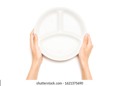 Woman hand hold a white ceramic dish isolated on white.