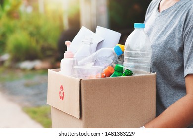 woman hand holdging box garbage for recycle