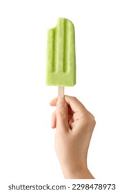 Woman hand holding bitten green fruit popsicle isolated on white background. Apple, lime and pear flavor