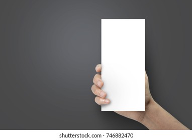 Woman Hand Holding A Blank Brochure Booklet Mock Up On A Black Background.