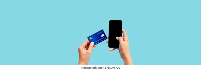 Woman hand holding blue credit card and using smart phone isolated on blue background, front side view. Blue bank-card design mock up. mobile payment ,online shopping concept - Shutterstock ID 1715095726