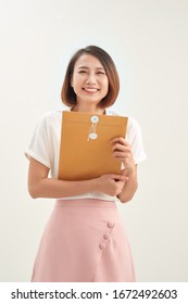 Woman Hand Holding Brown Envelope On White Background