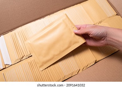 Woman Hand Holding Bubble Envelope For Postal Shipping