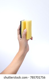 Woman hand holding a cleaning sponge