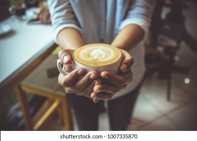 Woman Hand Holding Coffe Cup In Coffee Shop 