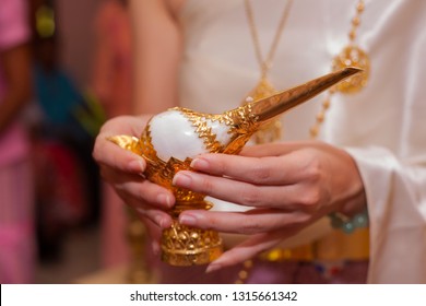 Woman Hand Holding Conch Shell In Traditional Thai Wedding Ceremony.