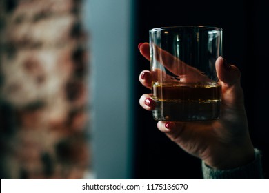 women drinking whiskey