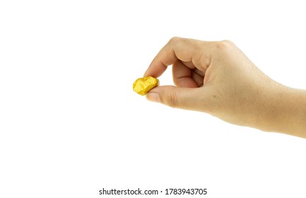 Woman Hand Holding Gold Nugget At The White Background