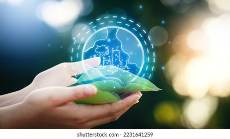 Woman hand holding leaf with smart city icon concept. The environment is of a business connection and sustainable development. renewable energy is environmentally friendly. Technology and new forward. - Shutterstock ID 2231641259
