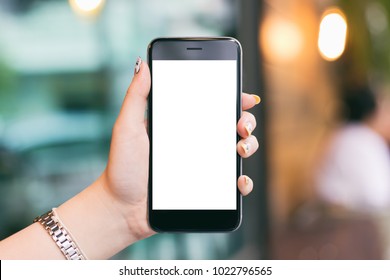 Woman hand holding mobile smartphones isolated white screen for mockup design and others app display background - Shutterstock ID 1022796565