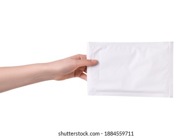 Woman hand holding paper bubble mail envelope