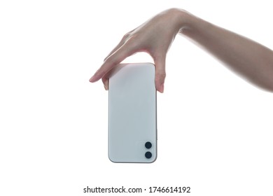 Woman Hand Holding Phone Isolated On A White Background.  Back View, Up Side Down.
