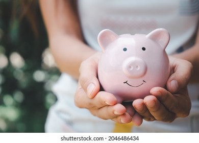 Woman Hand Holding Piggy Bank, Saving, Charity,  Fundrasing Community Care, Superannuation, Financial Crisis Concept