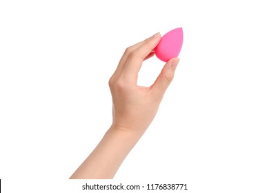 Woman Hand Holding Pink Beauty Sponge Isolated On White. 