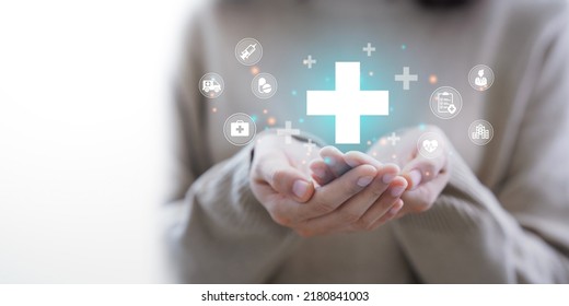 Woman hand holding plus icon for the healthcare medical icon. Health insurance health concept. access to welfare health and copy space, - Shutterstock ID 2180841003