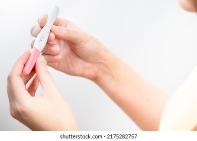  woman hand  holding pregnancy test. result female health problems and infertility. successful treatment IUI Intra – Uterine Insemination and ICSI. Pregnancy is not ready in adolescence.
 - Shutterstock ID 2175282757