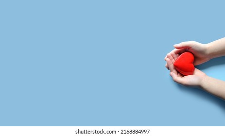 Woman hand holding red heart, World health day, Health care and mental health concept, Health insurance, Charity volunteer donation, CSR responsibility, World heart day	 - Shutterstock ID 2168884997