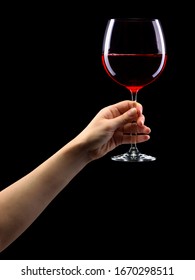 Woman Hand Holding Red Wine Glass Isolated On Black Background With Clipping Path