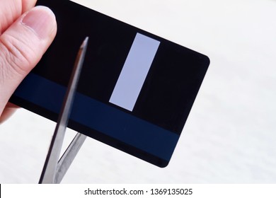 Woman Hand Holding Scissors To Cut Credit Card (concept Of Quit Spending / Credit Card Debt Awareness / No Card -cash Only /debt Paid Off ) Isolated On White Back Ground With Copy Space.