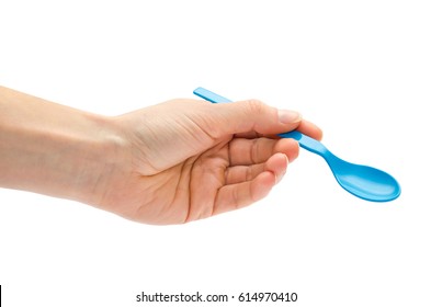 Woman Hand Holding Small Spoon For Kids. Isolated On White Background