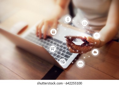 Woman hand holding smart phone with graphic icon multichannel online banking payment network communication - Shutterstock ID 642255100