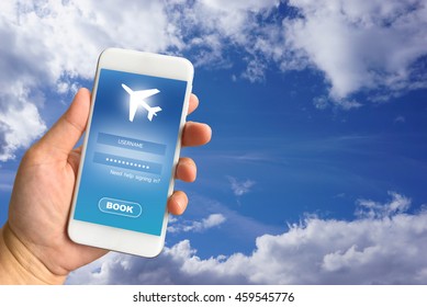 Woman hand holding smartphone against blur bokeh of airport background BOOK flights online concept