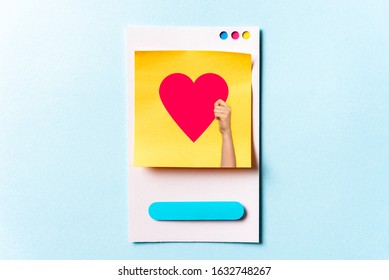 Woman hand holding a social media concept with red heart symbol on paper card and blue background. Digital marketing concept. - Shutterstock ID 1632748267