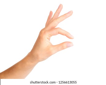 Woman Hand Holding Something Little With Two Fingers. Isolated With Clipping Path.