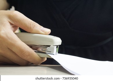 Woman Hand Holding A Stapler, Close-up.