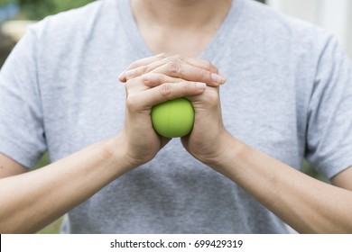 Woman Hand Holding A Stress Ball 