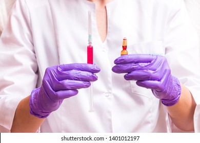 Woman Hand Holding Syringe And Ampule
