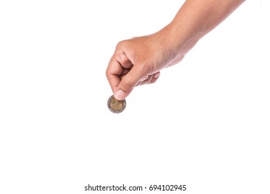 Woman Hand Holding Thai Coin (baht). Studio Shot And Isolated On White Background