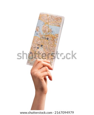 Woman hand holding tourist map, guide isolated on white background. Travelling, going to trip, visiting places of interests, attractions concept. High quality photo